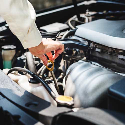 Image of someone working on a car engine representing Dual modality